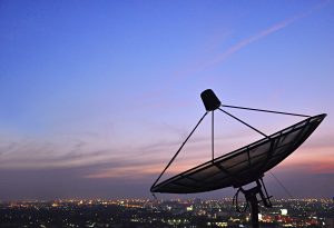 A satellite dish in twilight scene
