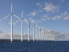 Enormous windmills standing in the sea