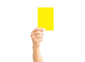 Yellow-Card-Hand-300x217.jpg